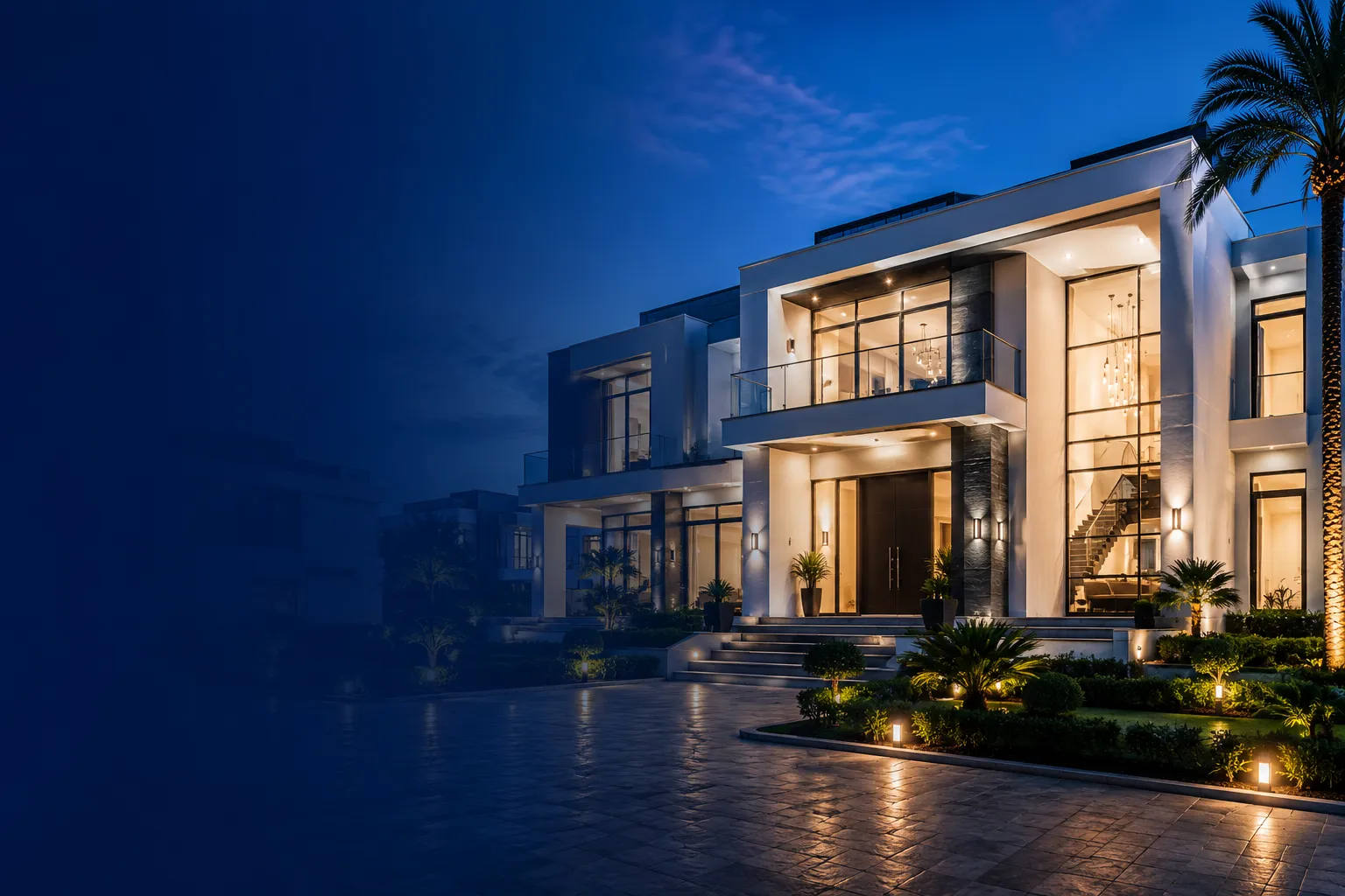 Completed luxury residence at dusk with warm interior lighting, an AB24-delivered project